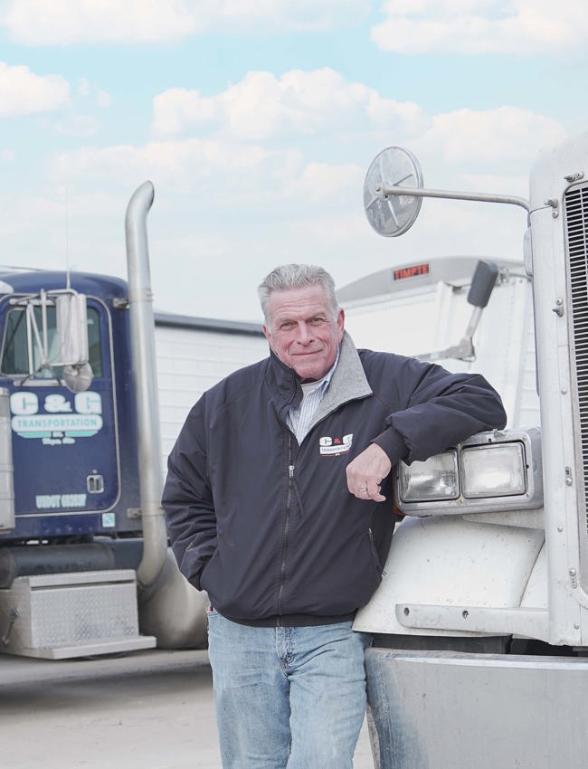 The Andersons customer standing with truck fleet