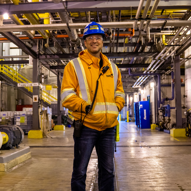 Individual standing in an ethanol plant