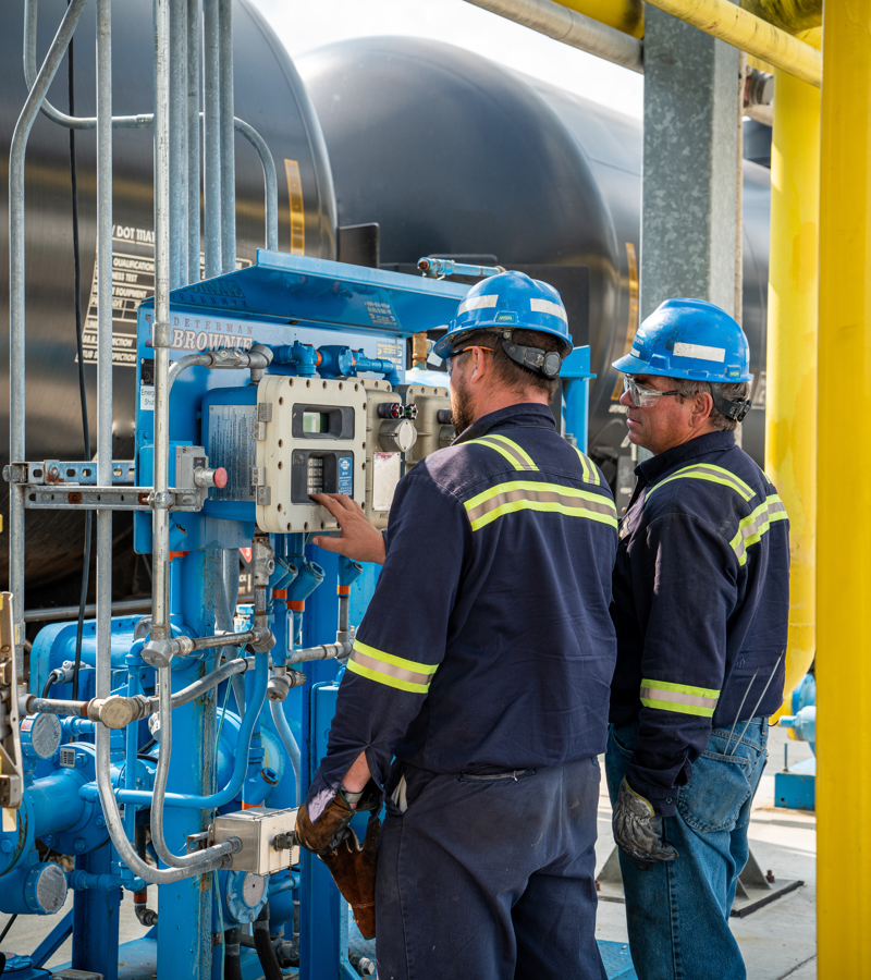 Individuals working at an ethanol plant