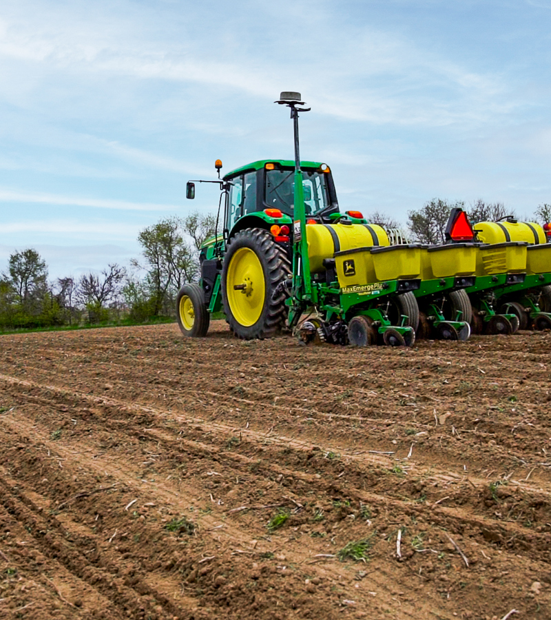 Tractor planting a field