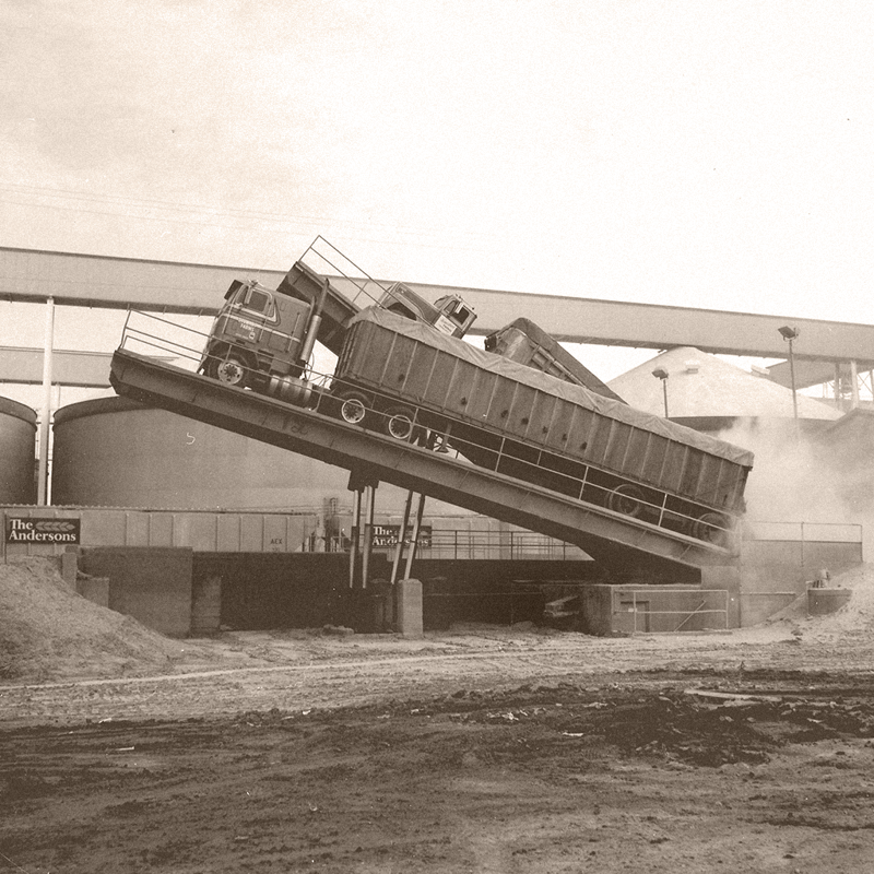 Trucks dumping their loads at The Andersons Elevator in the 1970s