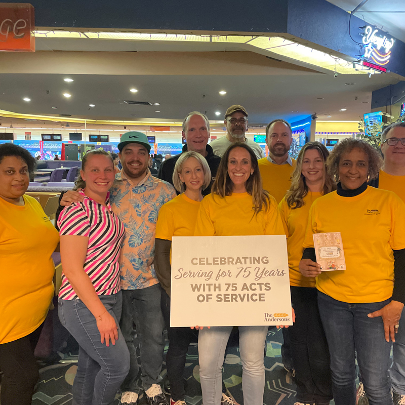 Individuals gathered at a bowl-a-thon event in support of the Junior Achievement organization