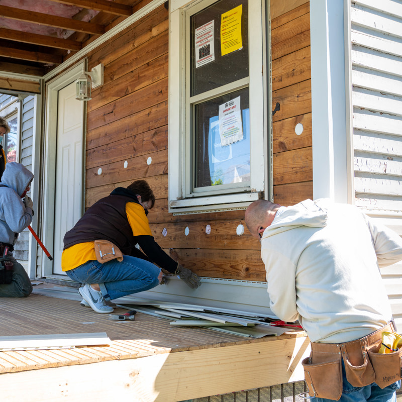 Individuals volunteering for a house build