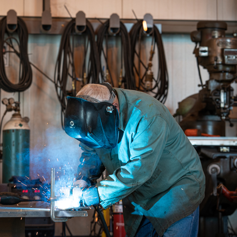 A welder working in the maintenance shop at an ethanol plant location