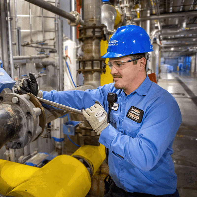 Individual working at an ethanol plant in the 2000s