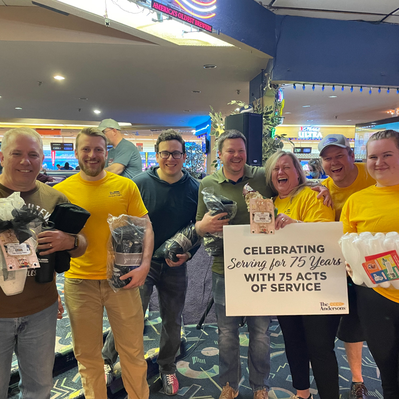 Individuals gathered at a bowl-a-thon event in support of the Junior Achievement organization