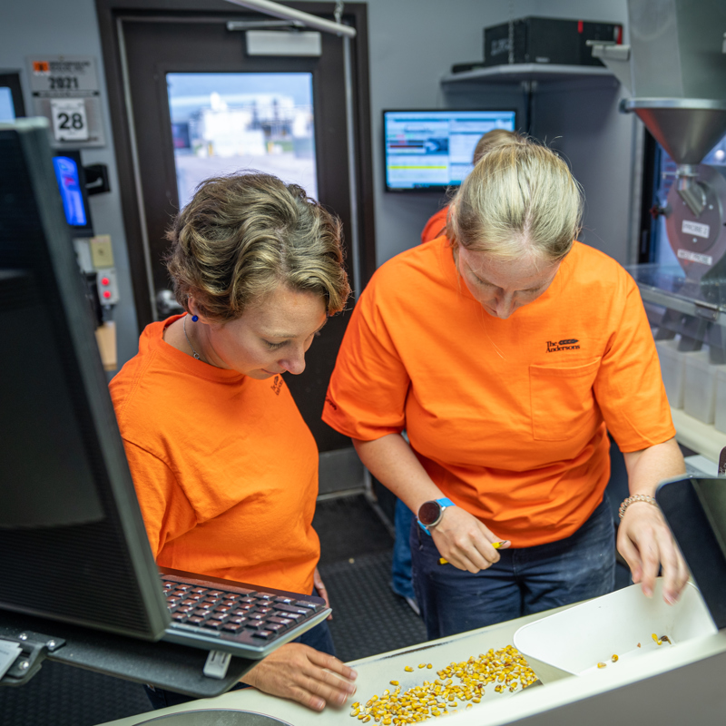 Individuals at grain inspection at an ethanol plant location