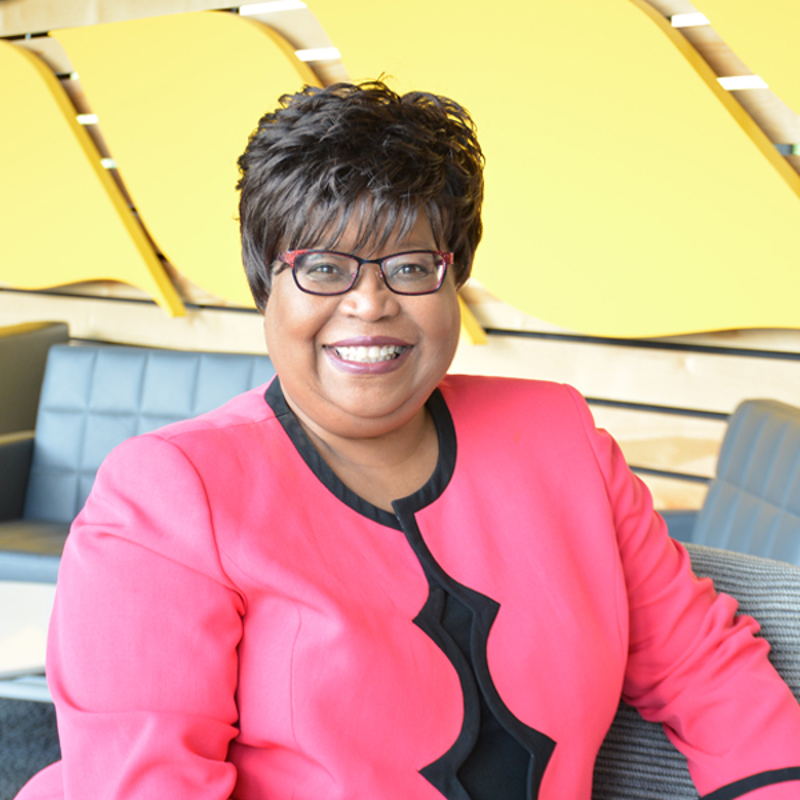 An employee smiling in the front cafe of The Andersons headquarters