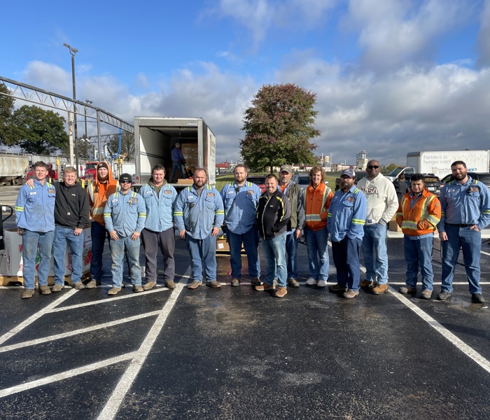 Employees standing together for group photo