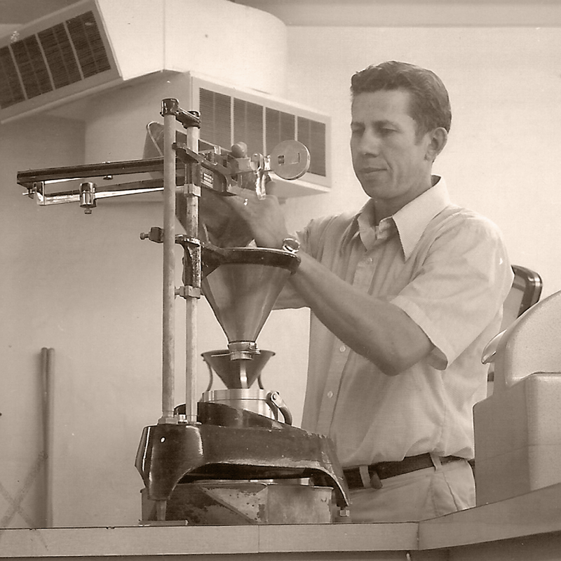 Individual at grain inspection during the 1970s