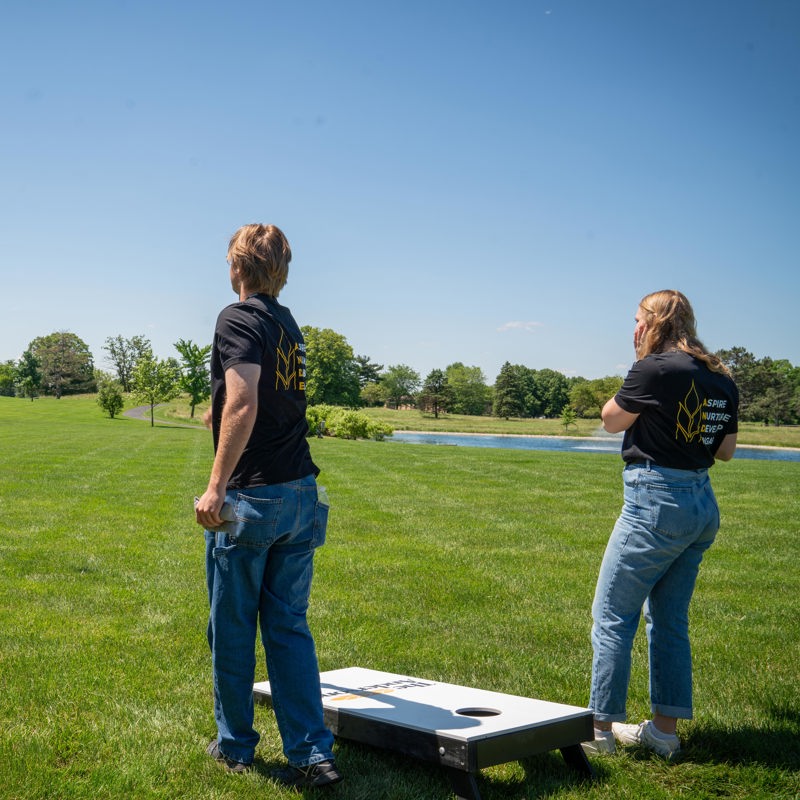 Interns playing cornhole