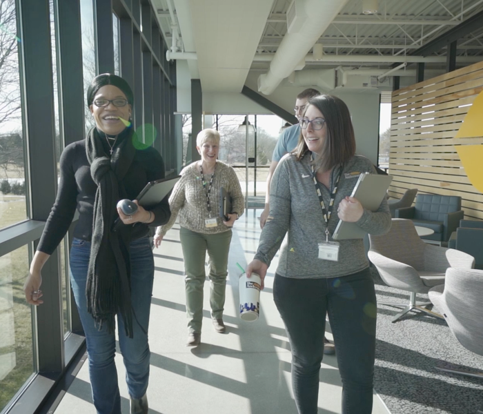 Individuals walking together toward the front of The Andersons headquarters